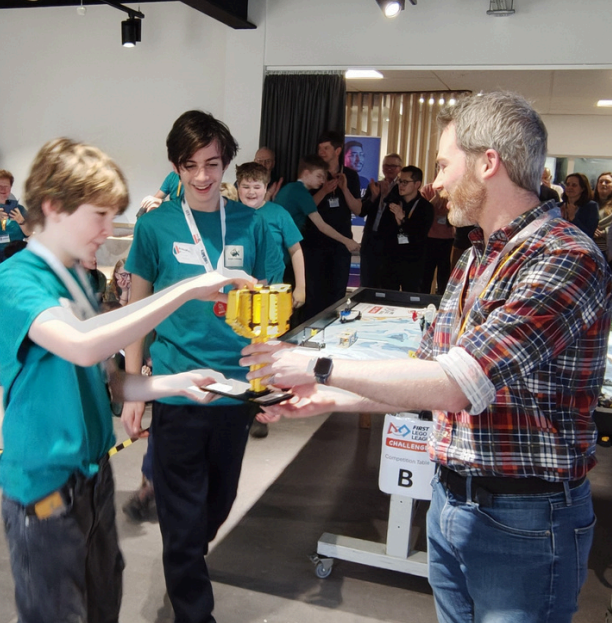 Sam giving award to students