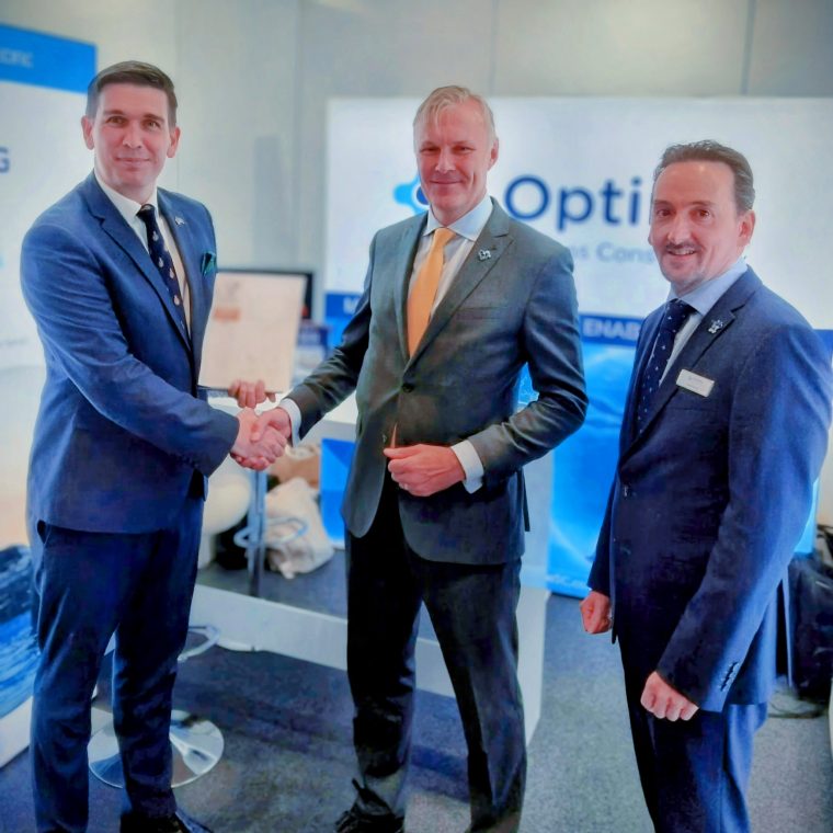 Tony Blaney, Senior Relationship Manager (MOD) presents the Armed Forces Covenant Bronze Award to Chris Lamb (MD) and Lloyd Pryce (Director) at Optima