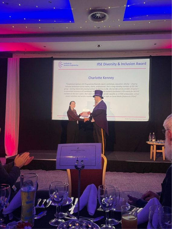 Charlie Kenney receiving her award at ASEC dinner.